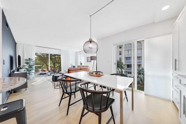 dining area with light wood-type flooring