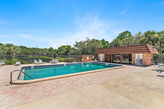 view of swimming pool featuring a patio