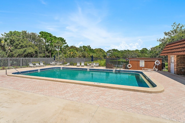 view of swimming pool with a patio area