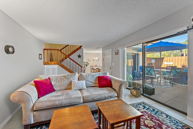 tiled living room with a textured ceiling