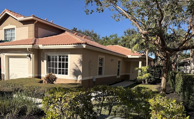 view of side of property featuring a garage