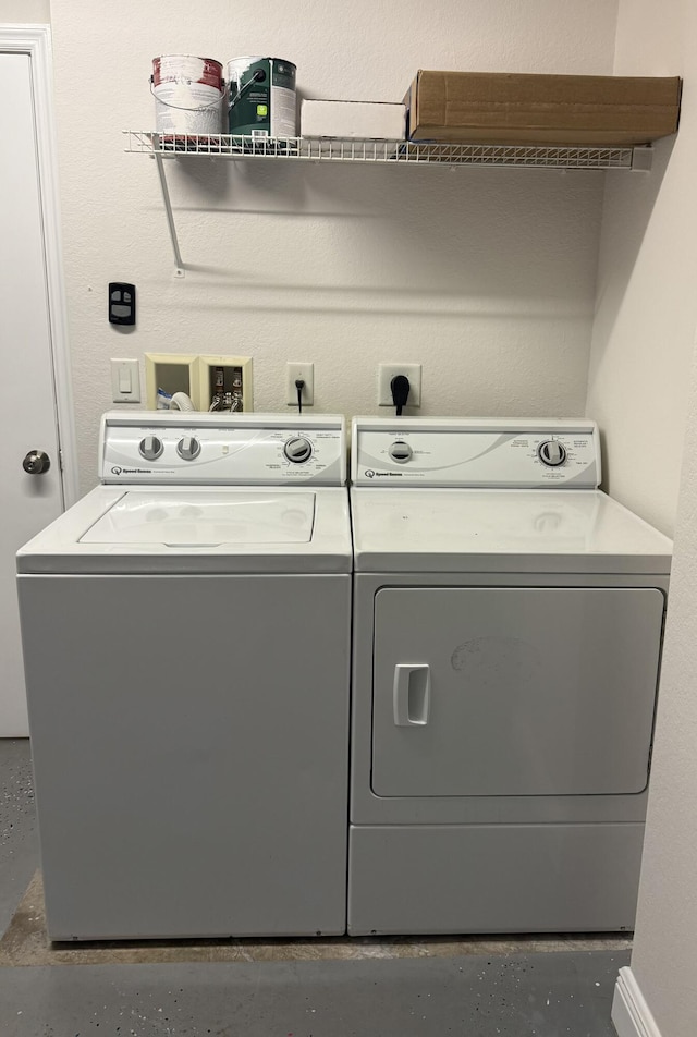 washroom featuring independent washer and dryer