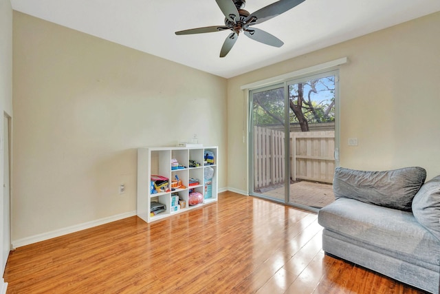 living area featuring ceiling fan and light wood-type flooring