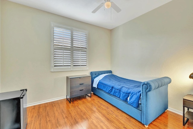 bedroom featuring ceiling fan and light wood-type flooring