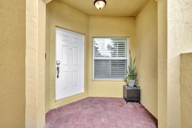 doorway to property featuring a patio area