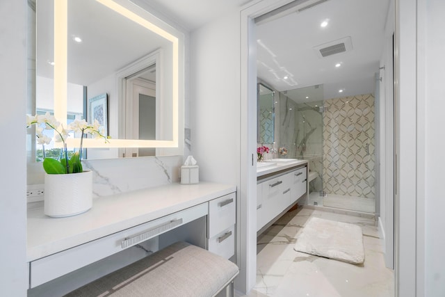 bathroom with vanity and an enclosed shower