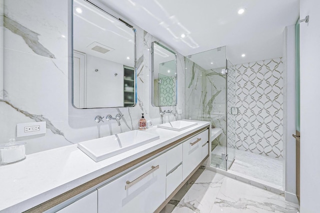 bathroom featuring vanity and a shower with shower door