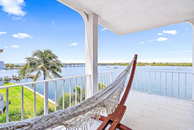 exterior space with a balcony and a water view