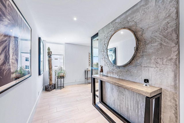 hallway with light hardwood / wood-style flooring