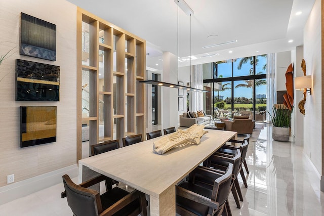 dining room featuring a wall of windows