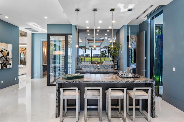 kitchen featuring pendant lighting and a breakfast bar area