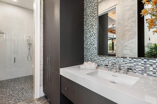 bathroom featuring vanity, tasteful backsplash, and walk in shower