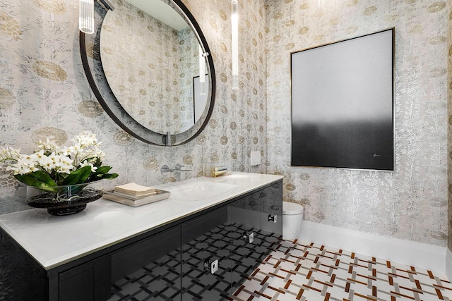 bathroom with tile patterned floors, vanity, and toilet