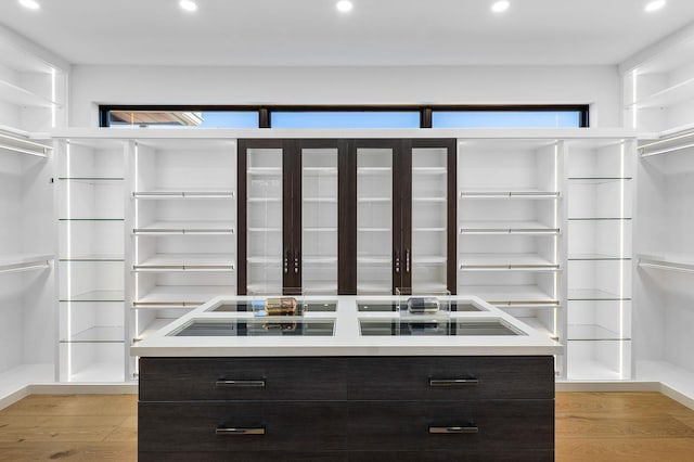 walk in closet featuring light hardwood / wood-style floors