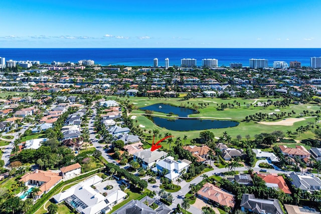 birds eye view of property featuring a water view