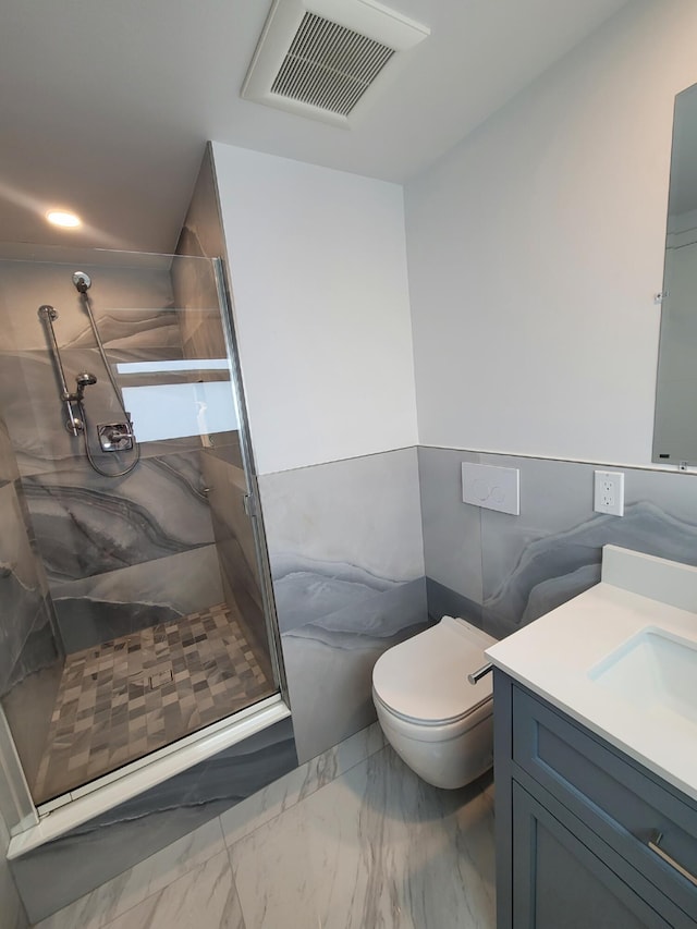 bathroom featuring walk in shower, vanity, toilet, and tile walls