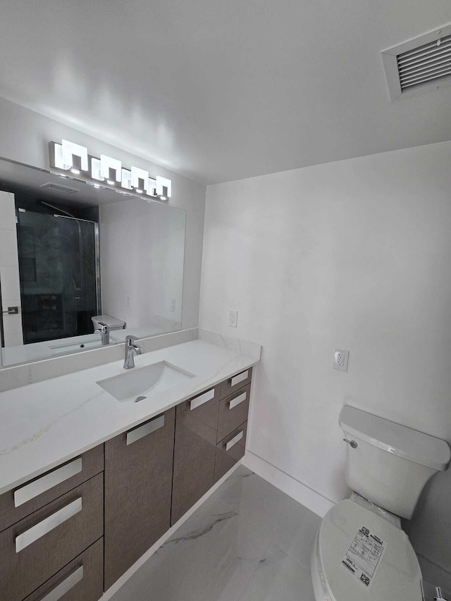 bathroom with visible vents, a shower stall, toilet, marble finish floor, and vanity