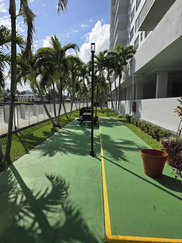 view of property's community featuring fence