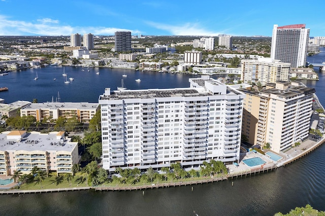 birds eye view of property featuring a water view and a view of city