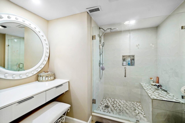 bathroom featuring vanity and walk in shower