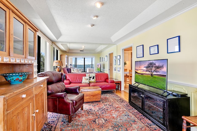 living room featuring a textured ceiling and hardwood / wood-style flooring