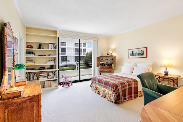 carpeted bedroom with access to exterior and crown molding