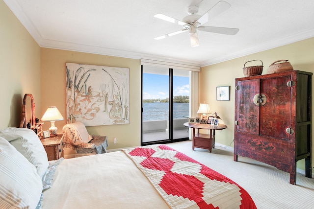 carpeted bedroom featuring access to exterior, a water view, ceiling fan, and crown molding