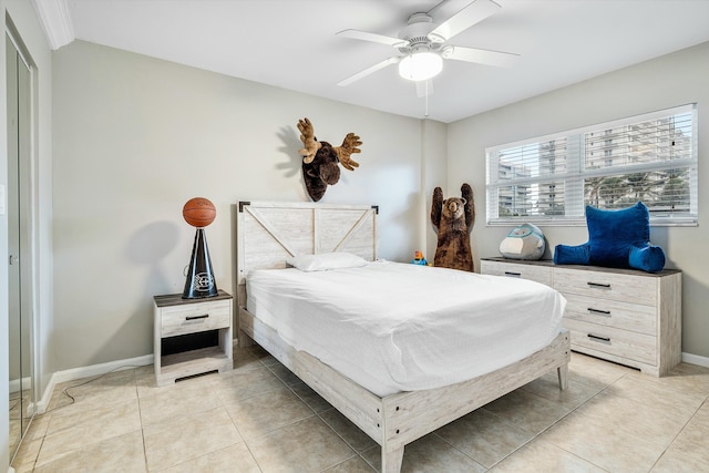 tiled bedroom with ceiling fan