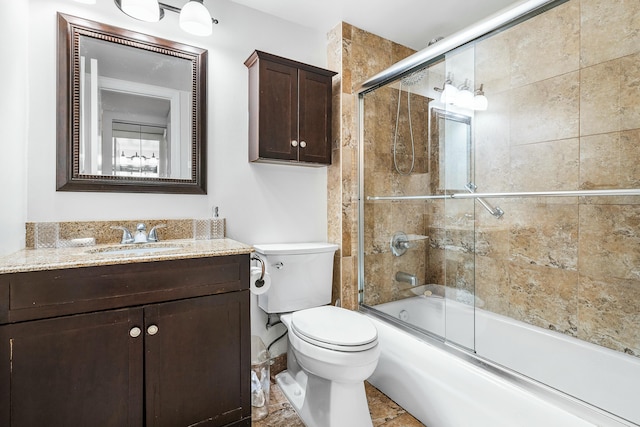 full bathroom with shower / bath combination with glass door, vanity, and toilet