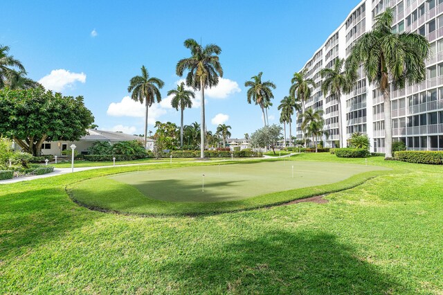 view of home's community featuring a lawn