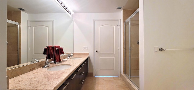 bathroom featuring vanity and a shower with door