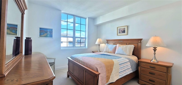 bedroom with light colored carpet