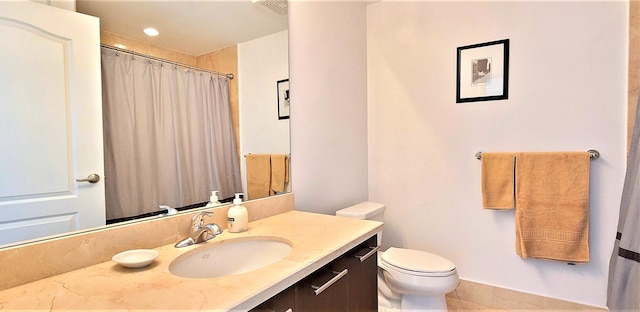 bathroom with vanity and toilet