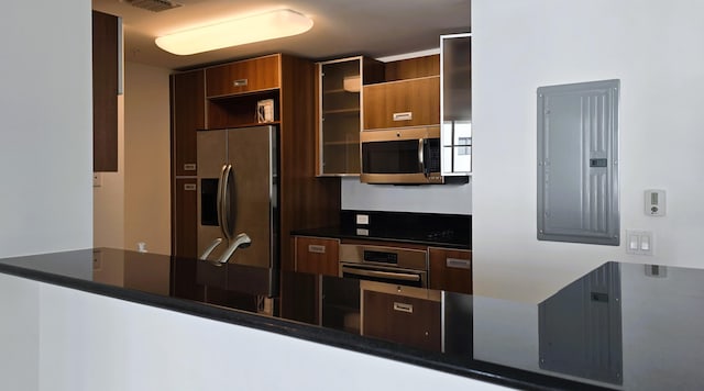 kitchen featuring electric panel and appliances with stainless steel finishes