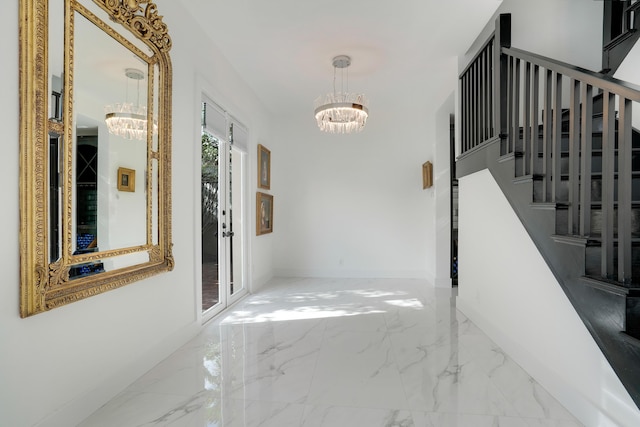 460 Surfside Ln, Juno Beach, FL 33408 - hallway featuring a chandelier, marble tiled flooring, stairway, and baseboards