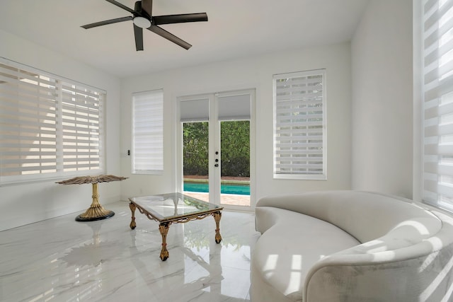 living area featuring ceiling fan