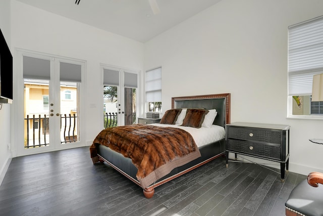 bedroom featuring dark hardwood / wood-style flooring, access to exterior, and french doors