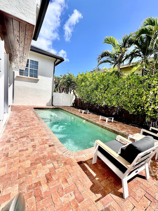 460 Surfside Ln, Juno Beach, FL 33408 - view of pool with a fenced backyard and a patio