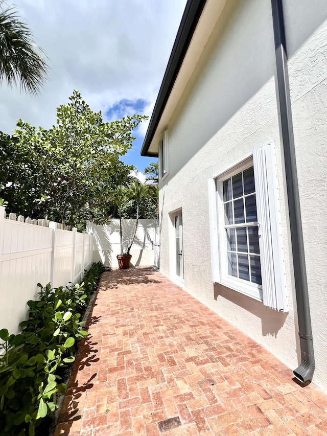 460 Surfside Ln, Juno Beach, FL 33408 - fenced backyard featuring a patio area