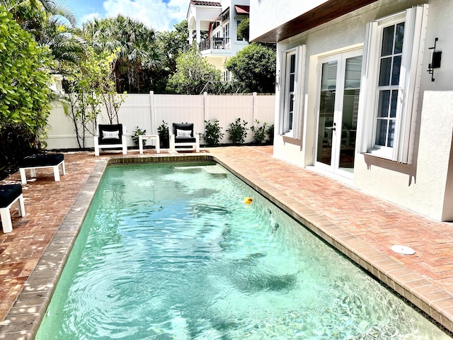 460 Surfside Ln, Juno Beach, FL 33408 - view of pool with french doors and a patio area