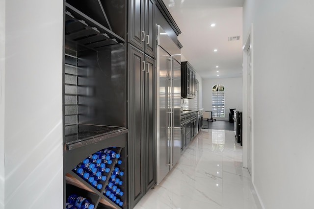 460 Surfside Ln, Juno Beach, FL 33408 - corridor featuring light marble finish floors, recessed lighting, and baseboards