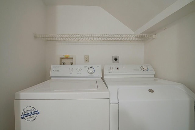 clothes washing area featuring separate washer and dryer