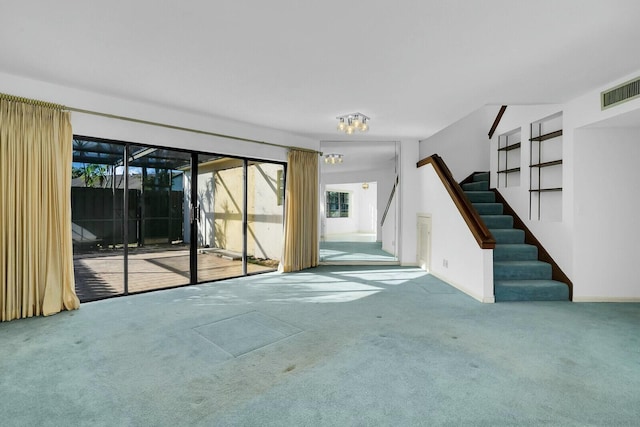 unfurnished living room featuring carpet flooring