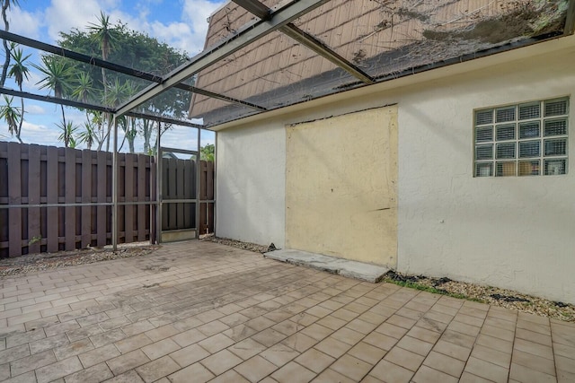 view of patio / terrace with glass enclosure