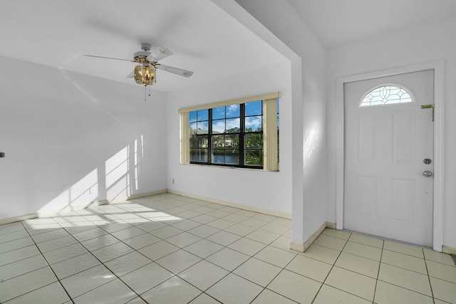 entrance foyer with ceiling fan and light tile patterned flooring