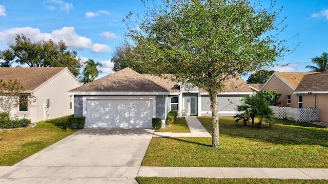 view of front of home with a garage and a front lawn