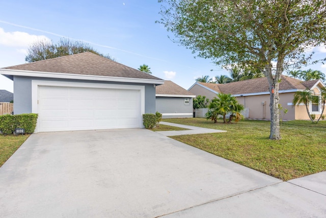 ranch-style home with a garage and a front lawn