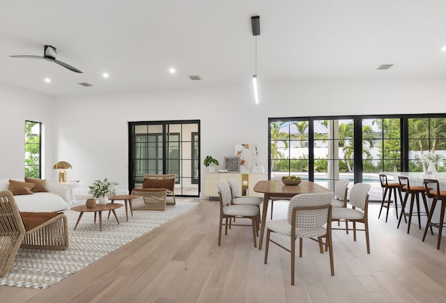 dining room featuring light hardwood / wood-style flooring and ceiling fan