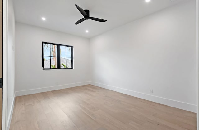 spare room featuring light wood-type flooring and ceiling fan