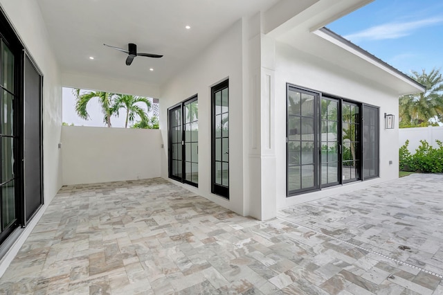 view of patio with ceiling fan and french doors